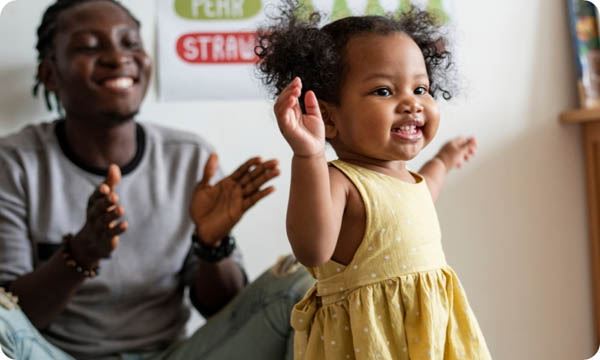 young girl in a yellow dress dancing