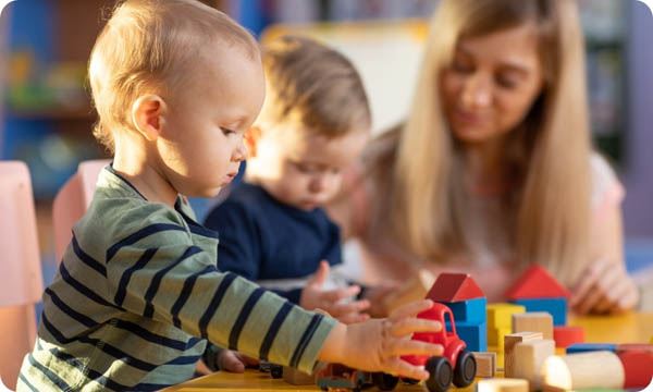 Preschool Teacher and Kids Play