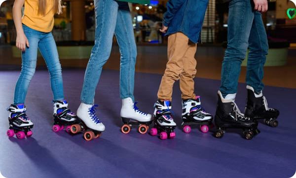 Partial View of Parents and Kids Skating on Roller Rink Together