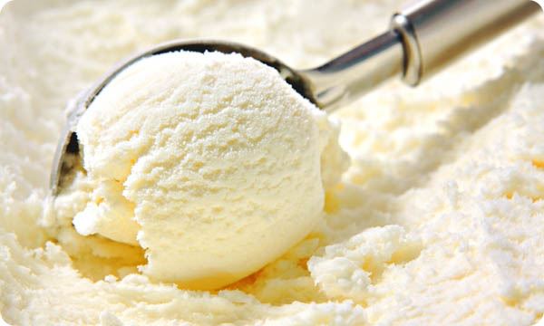 Vanilla Ice Cream Scooped Out of Container