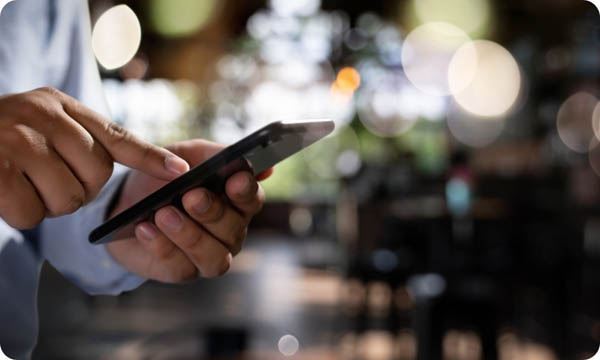 Man Holding En Hands and Using Digital Tablet  Mobile Phone Telephone with Blank Copy Space Scree