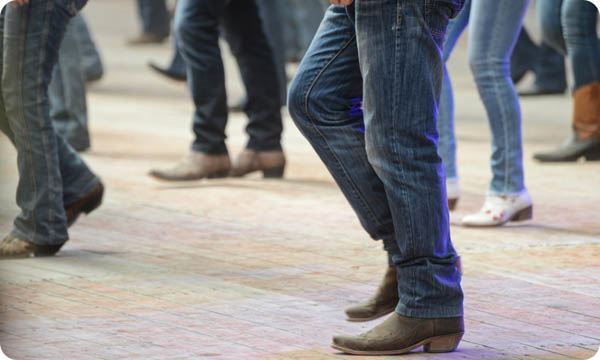 Men and Woman Line Dance in Country Club