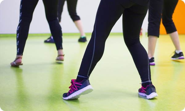 Women Practice Dancing in a Gym