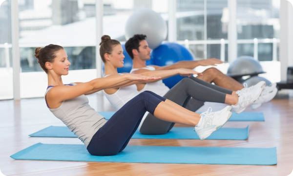 Class Stretching on Mats at Yoga Class