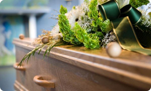 Casket with flowers on top